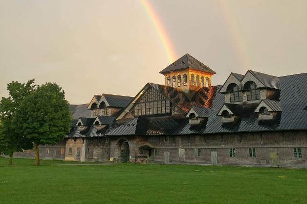 The Breeding Barn in 2020, two rainbows in the background. Photo by Claire Stodola.